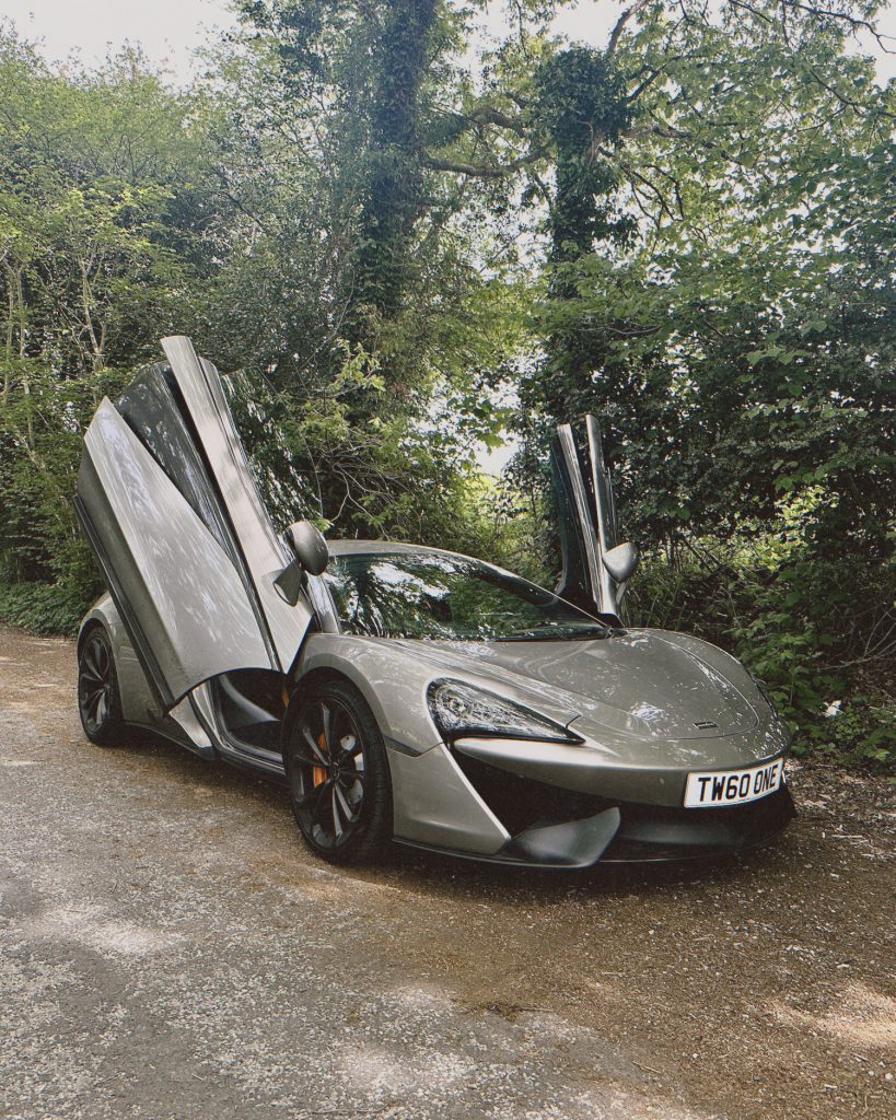 Silver McLaren with doors up
